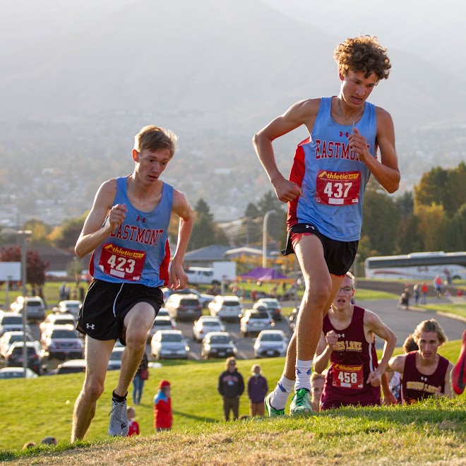 Senior Julian Ramos and Junior Carson Forster surging up a hill