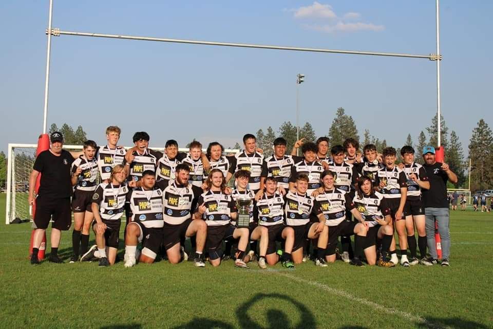 The 2022-2023 Schoolhouse Rugby Team holding the Cascade Region League Cup